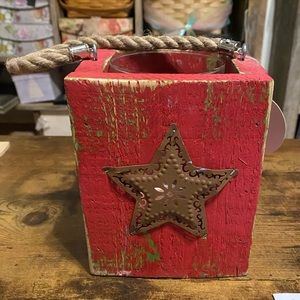 Rustic Lantern with star on 2 sides and rope handle.